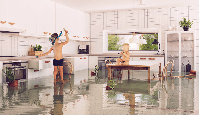 Boys playing in a flooded room