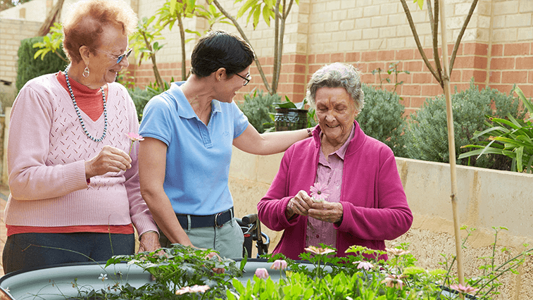 Residents enjoying native garden at Southern Cross Care.